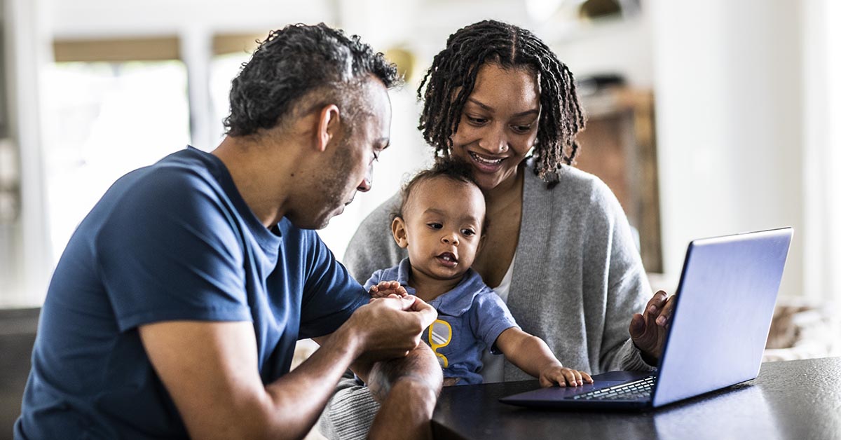 A family discussing financial planning on a digital tablet